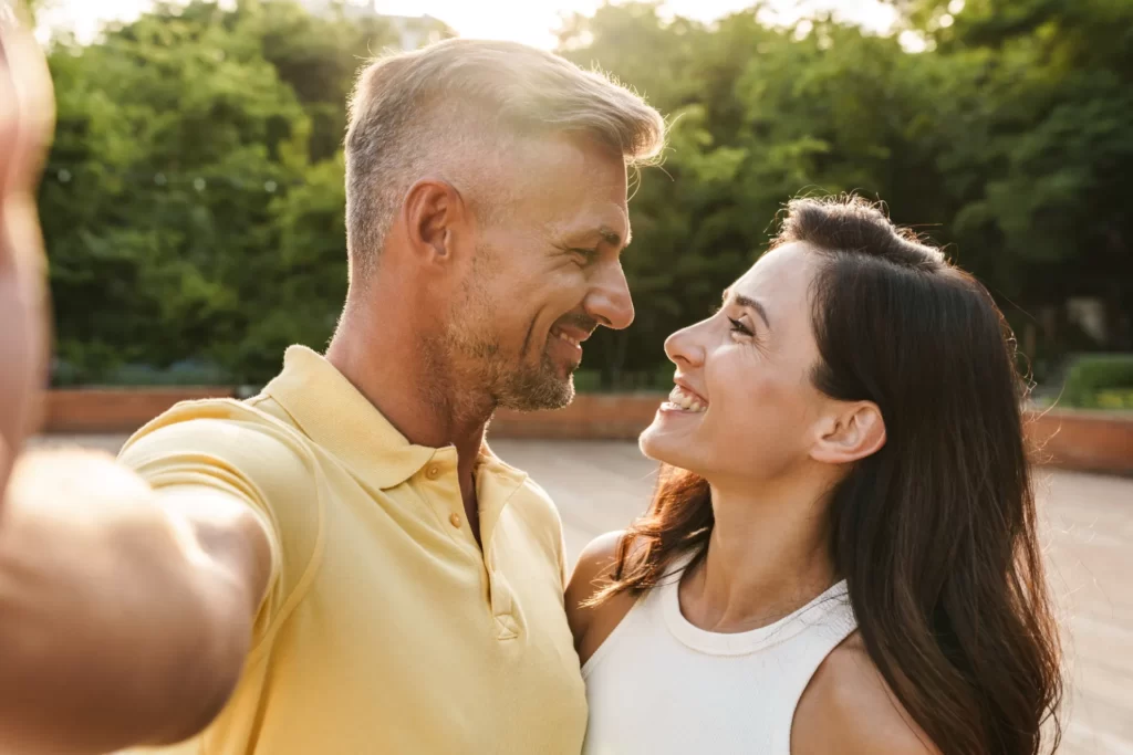 portrait of joyful middle aged couple taking selfi utc ()